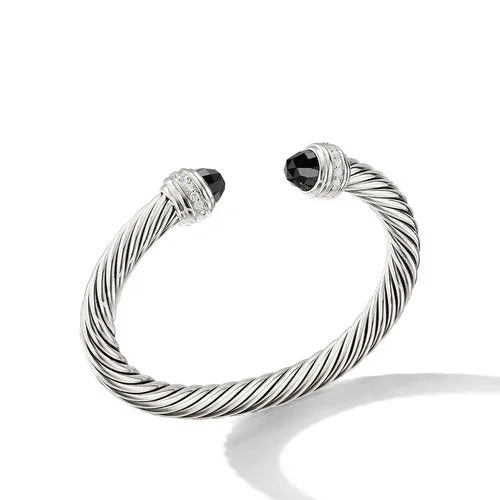 Bangles with twisted metal bands for flair -David Yurman  Bracelet in Sterling Silver