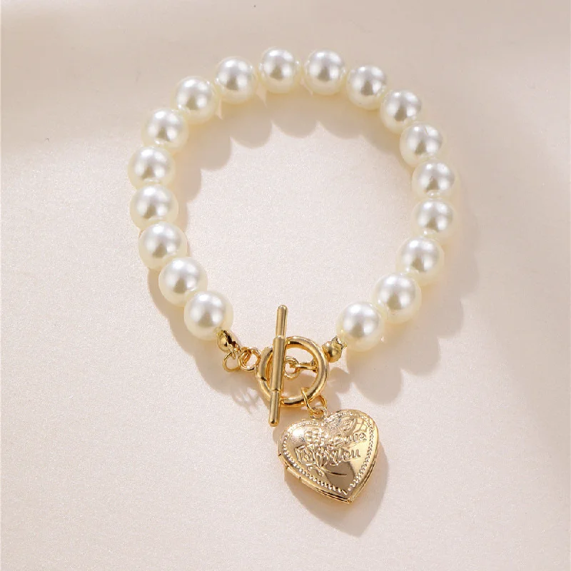 Bracelets with emerald stones for green luxury -Wholesale White Pearl Heart Alloy Bracelet