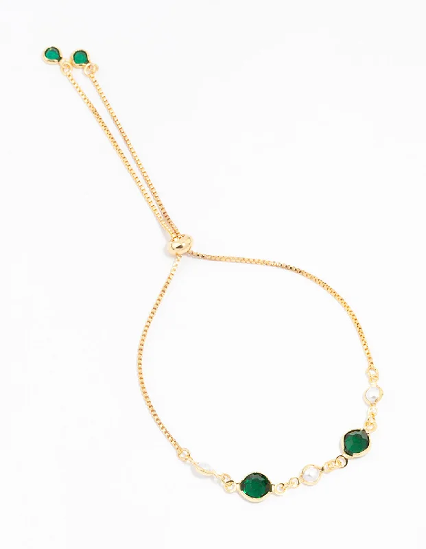 Gold bracelets with delicate diamond charm accents -Gold Plated Cubic Zirconia Round Emerald & Pearl Toggle Bracelet