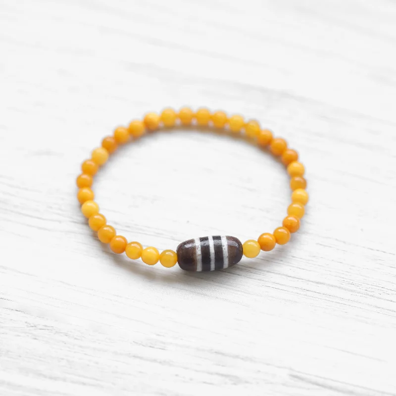 Bangles with faceted garnet for deep shine -Baltic Amber Striped Dzi Bracelet